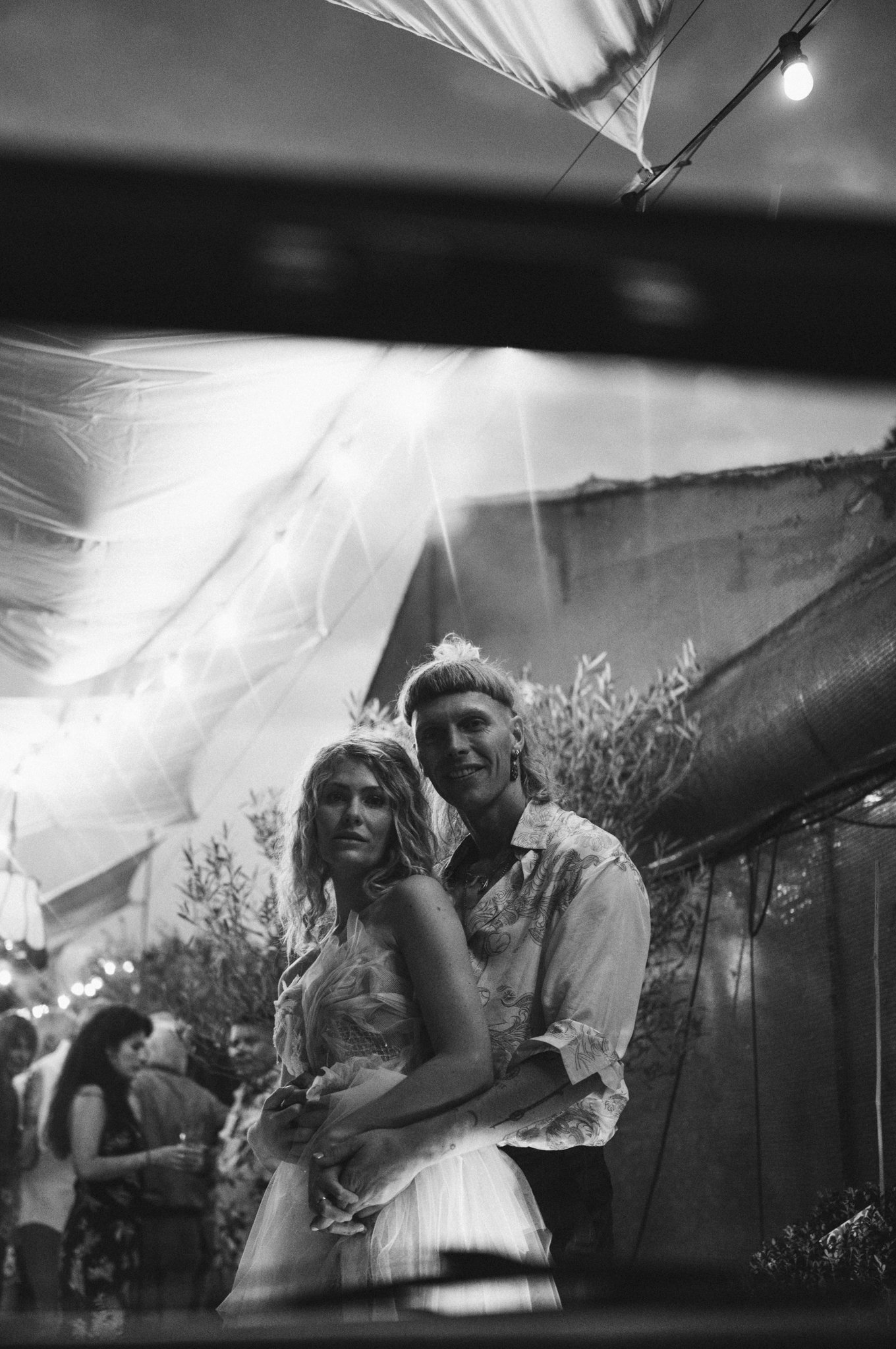 Eternal Moments: A Wedding Photography Collection by FADETOBLACK, wedding photography, image 30: Wedding series mixing black and white and color: a bride in a lace puff-sleeve dress beside a vintage car