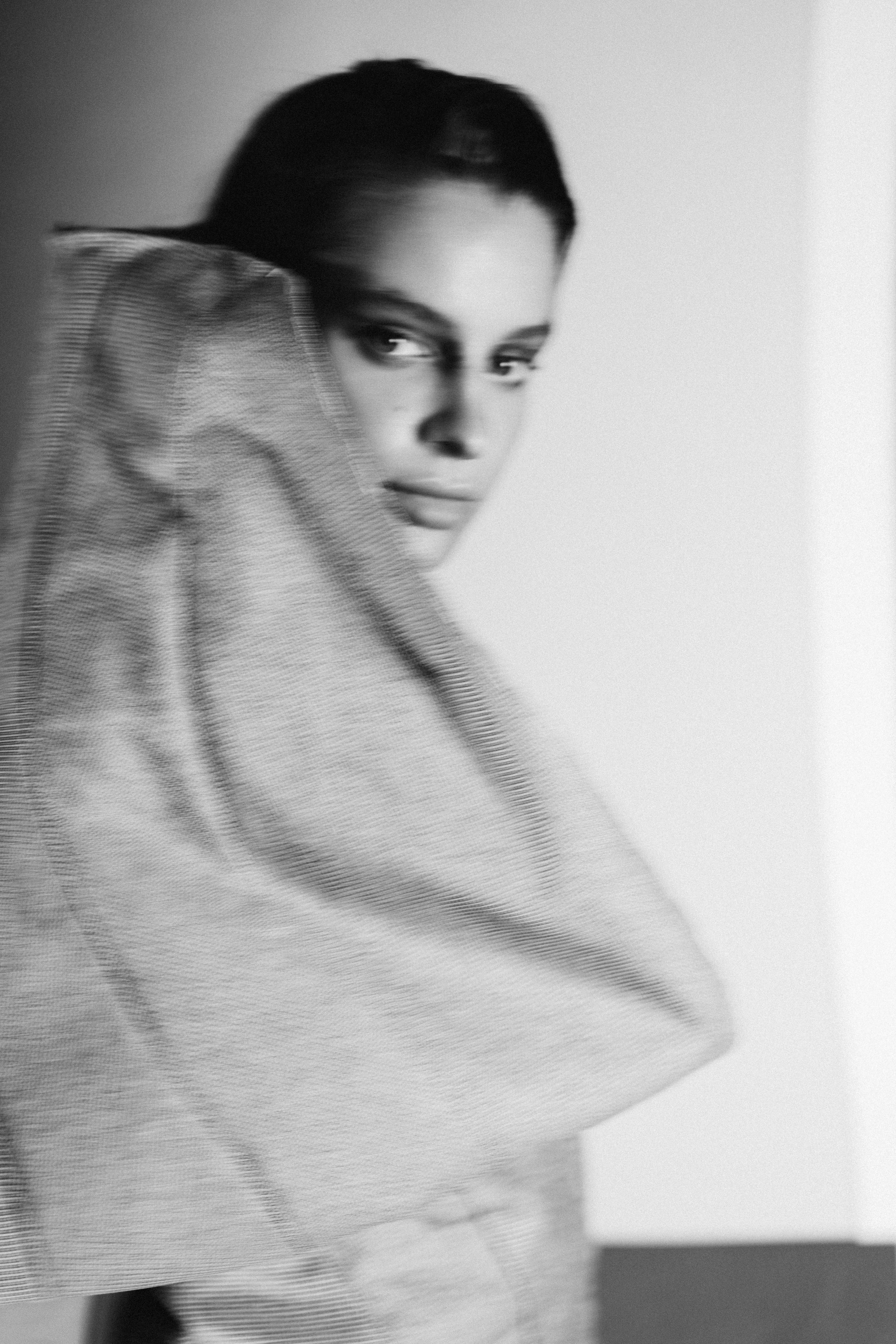 Laurin Schuler by FADETOBLACK, fashion editorial photography, image 17: Studio editorial for a designer collection: models wear sculptural hooded collar pieces in grey and