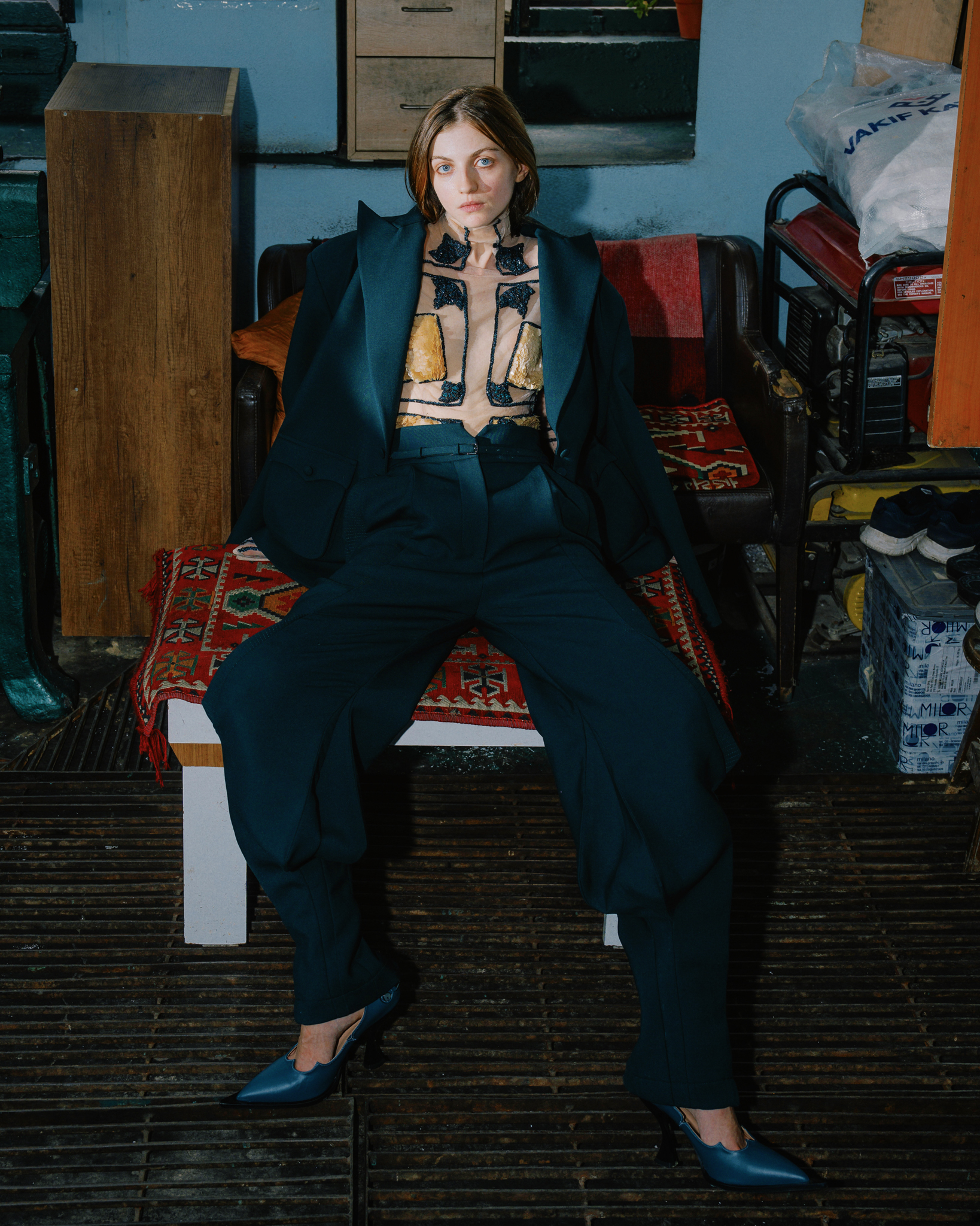 Tayfun Kaba by FADETOBLACK, editorial fashion photography, image 13: Editorial fashion shoot on busy Istanbul streets: models stand motionless in an embroidered dark red gown, a