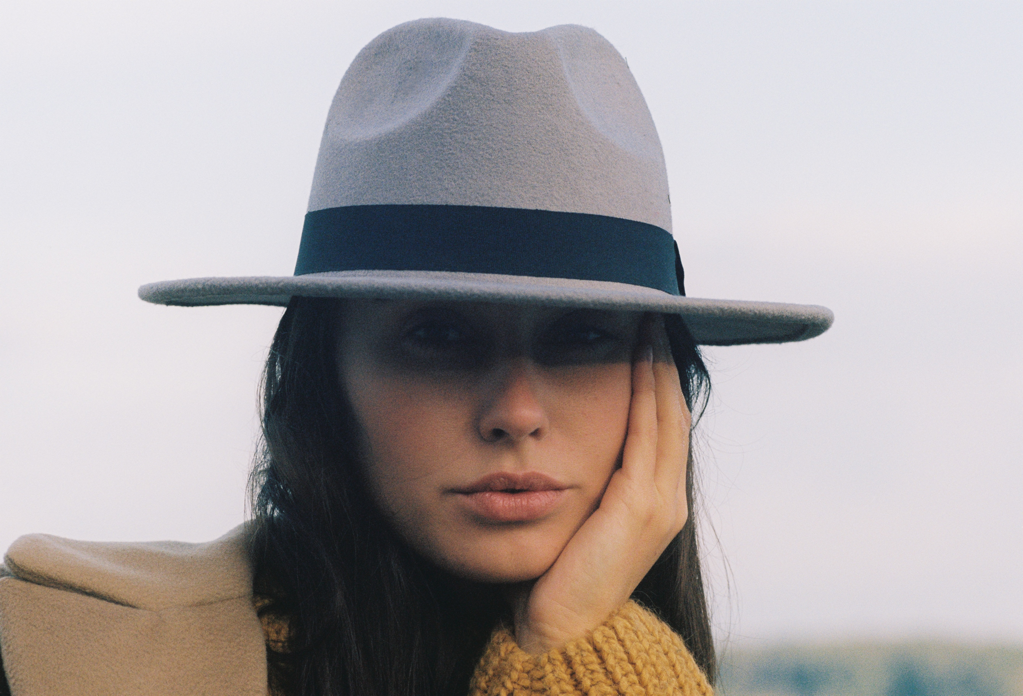 Emily: Autumn Elegance by FADETOBLACK, outdoor portrait photography, image 13: Autumn lakeside portrait series of a young woman with long brown hair wearing a mustard yellow knit and dress