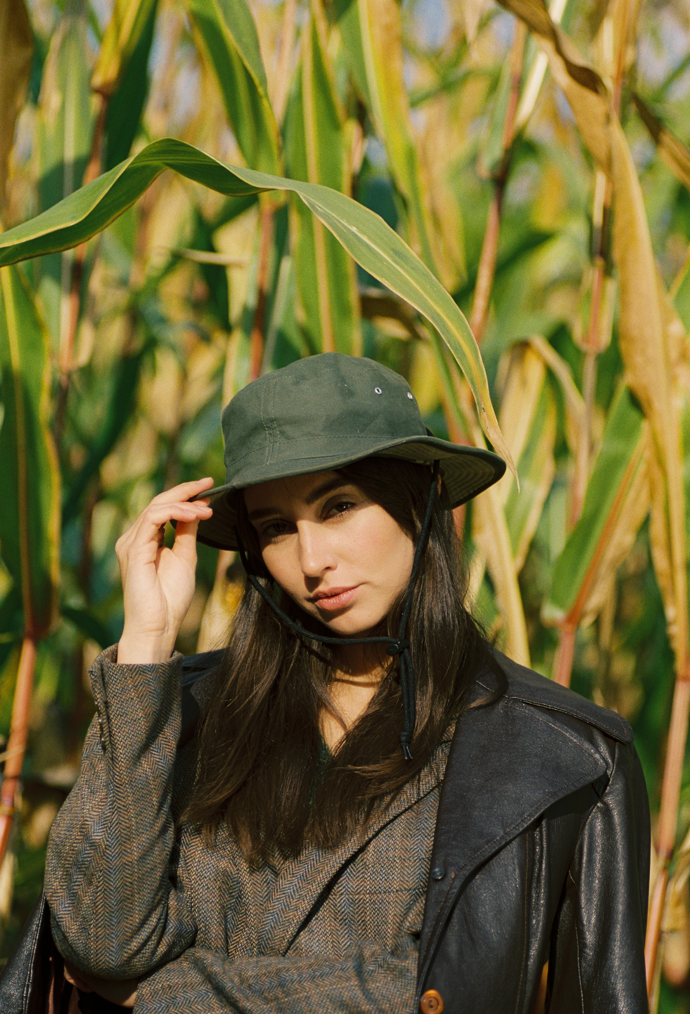 Emily: Autumn Elegance by FADETOBLACK, outdoor portrait photography, image 4: Autumn lakeside portrait series of a young woman with long brown hair wearing a mustard yellow knit and dress
