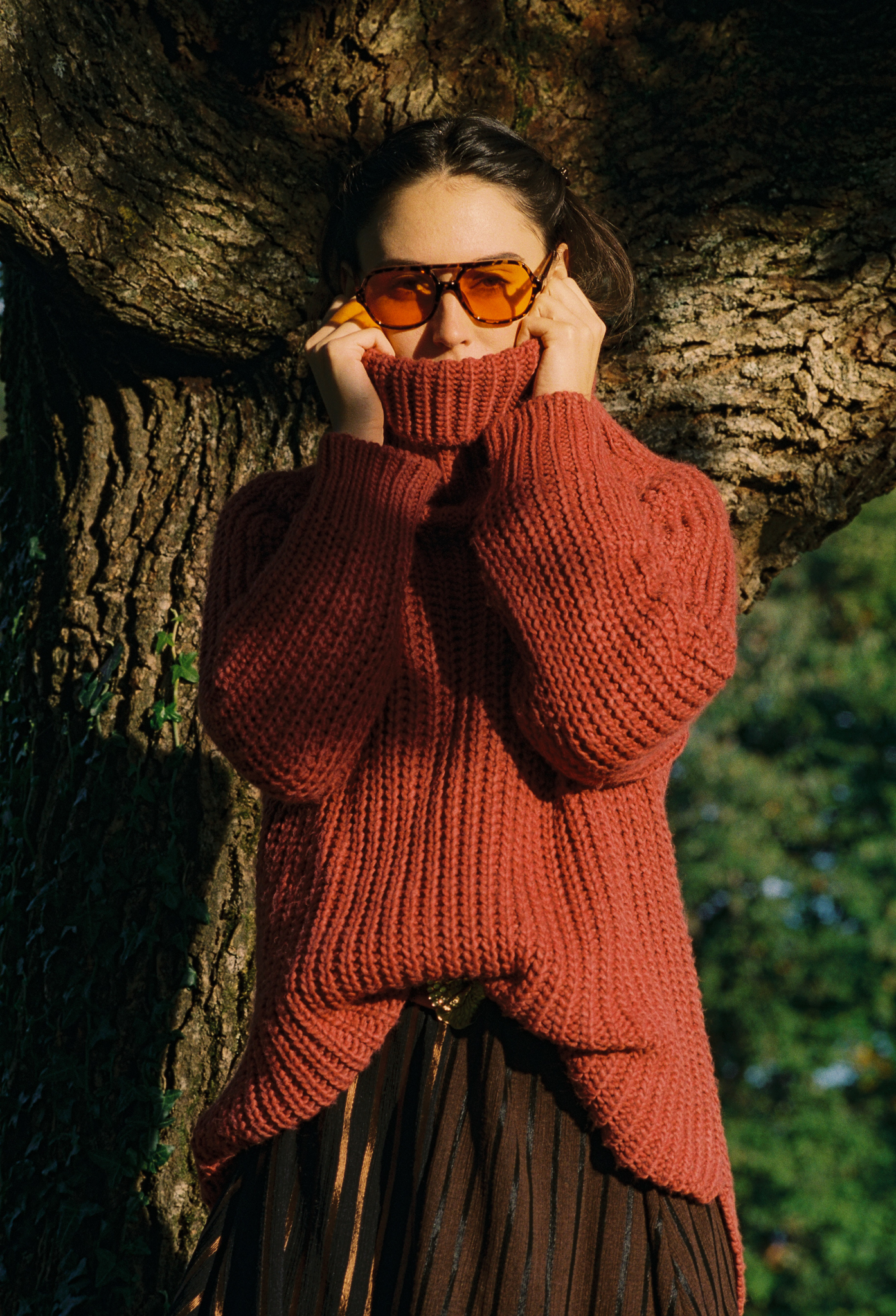 Emily: Autumn Elegance by FADETOBLACK, outdoor portrait photography, image 3: Autumn lakeside portrait series of a young woman with long brown hair wearing a mustard yellow knit and dress