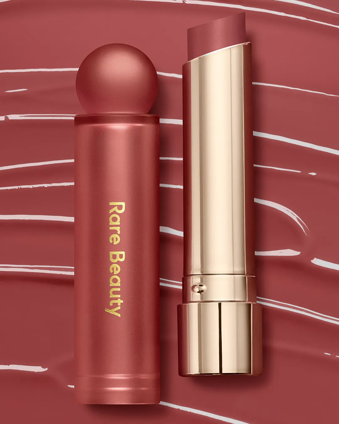 A tube of Rare Beauty's Soft Pinch Lip Oil Stick.
