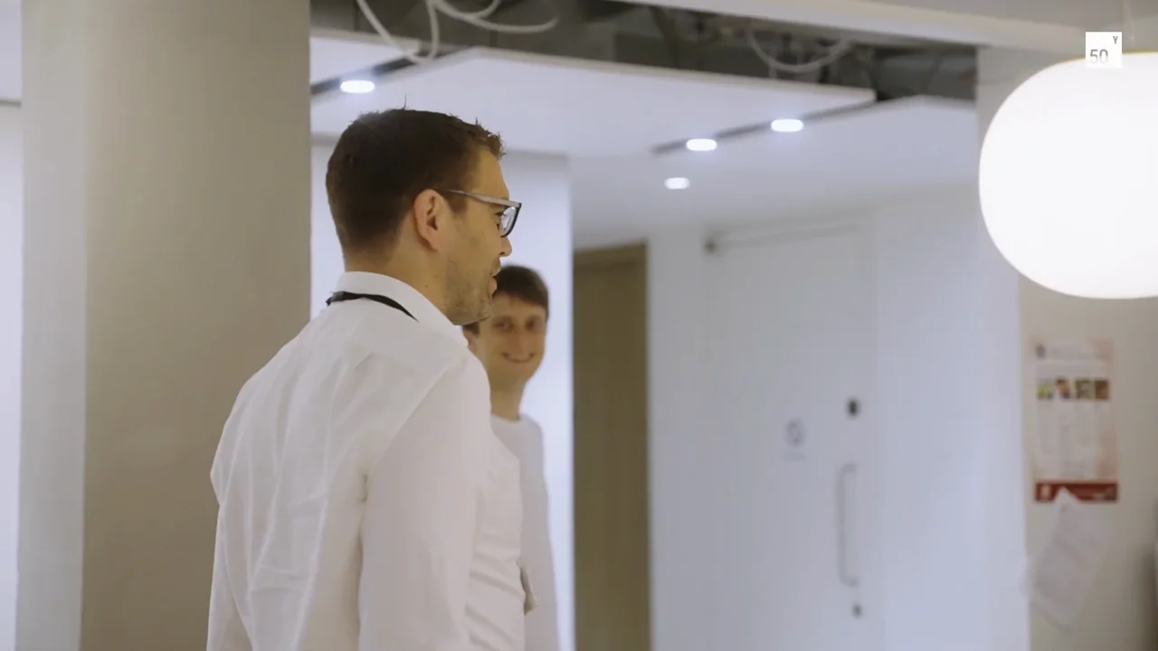 A researcher works inside ORCA Computing’s bright laboratory.