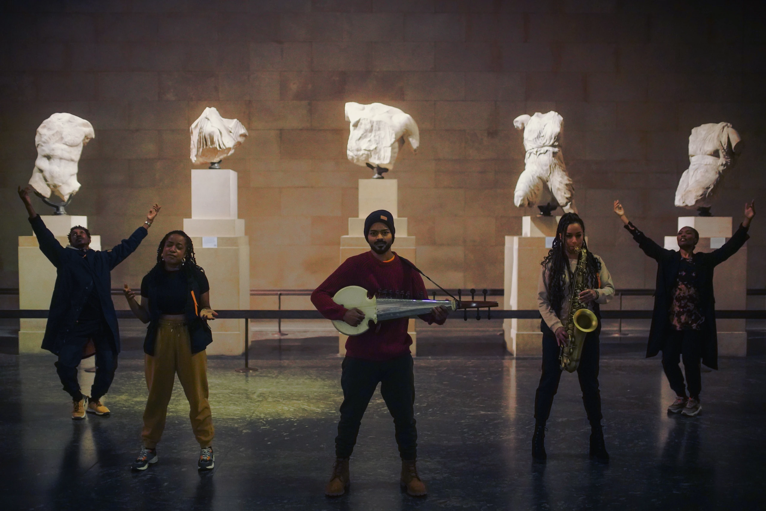 The Silent Spaces ensemble performing among the British Museum sculptures.