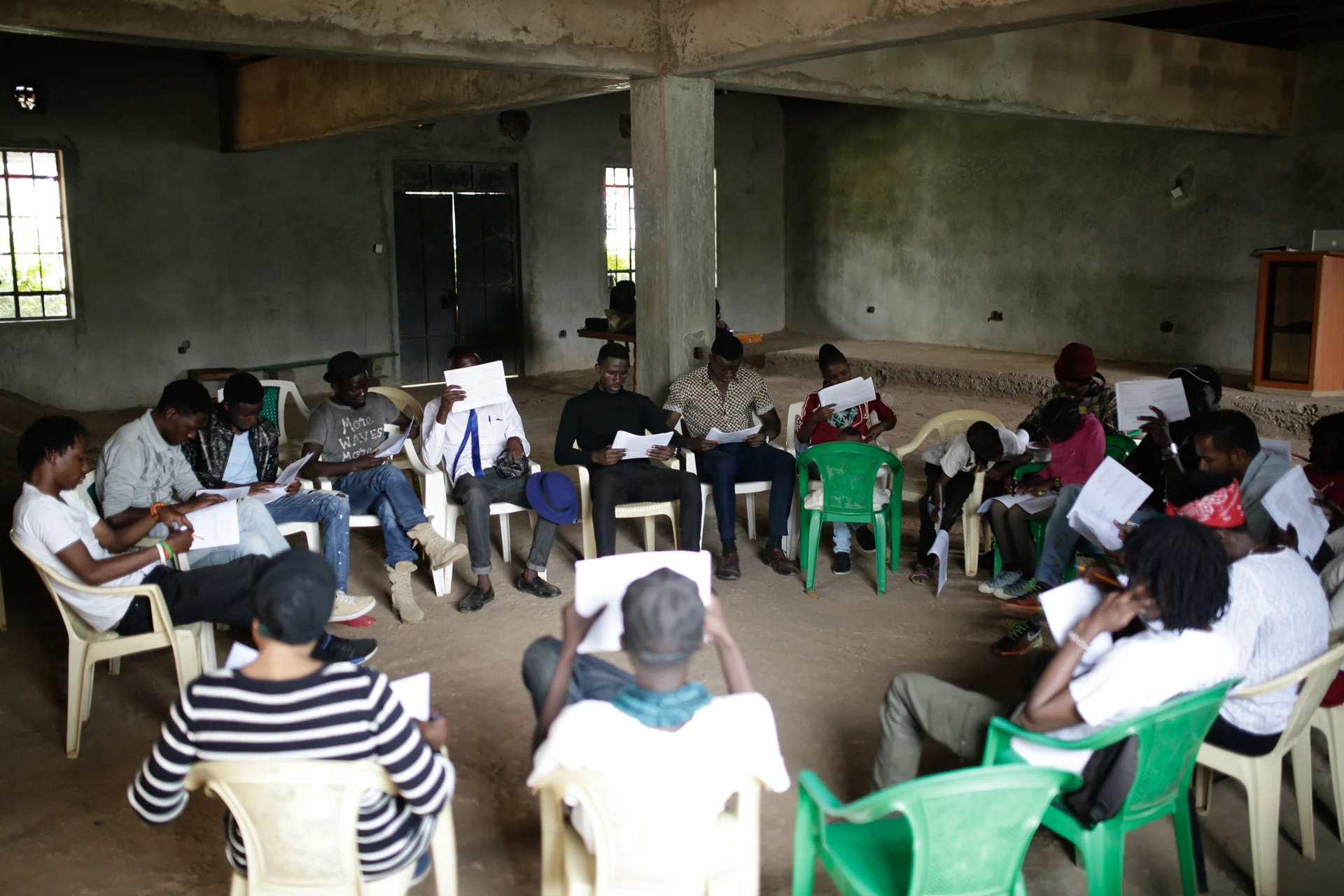 An ensemble of local performers gather for a script workshop