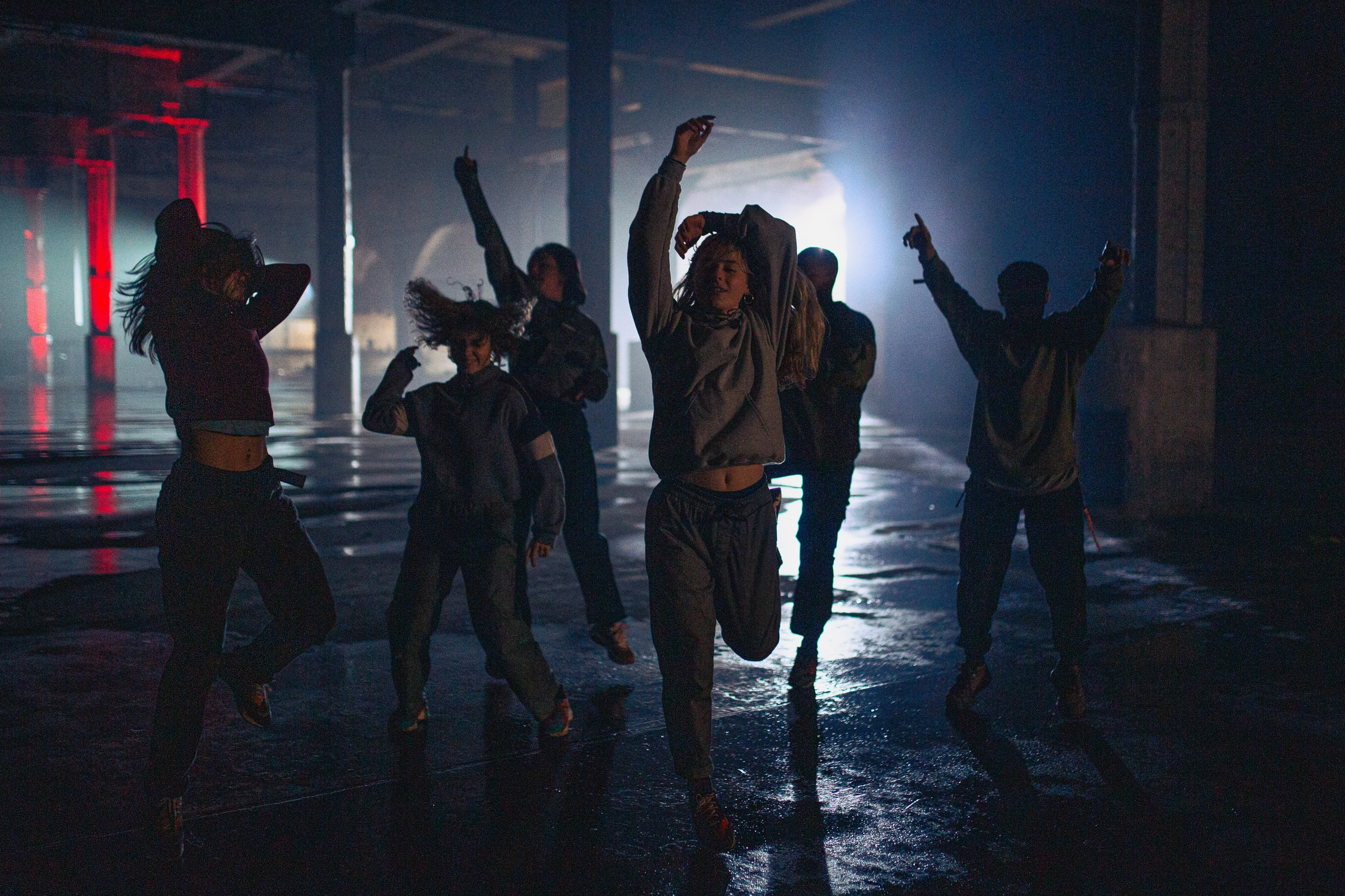 Movement / The ensemble gathers between takes.