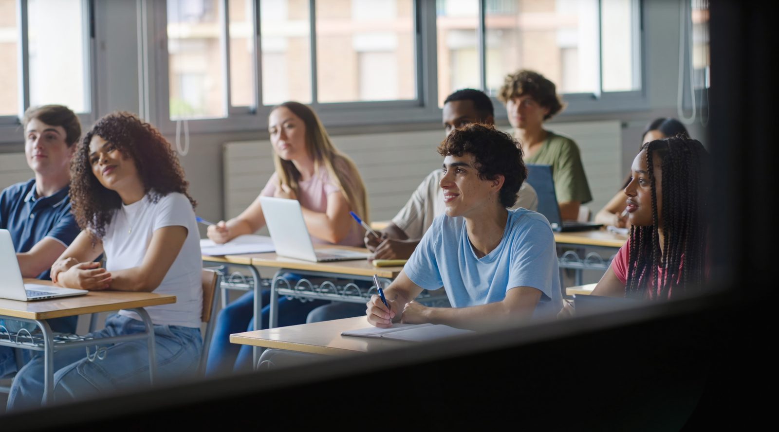 Students listening attentively in a classroom