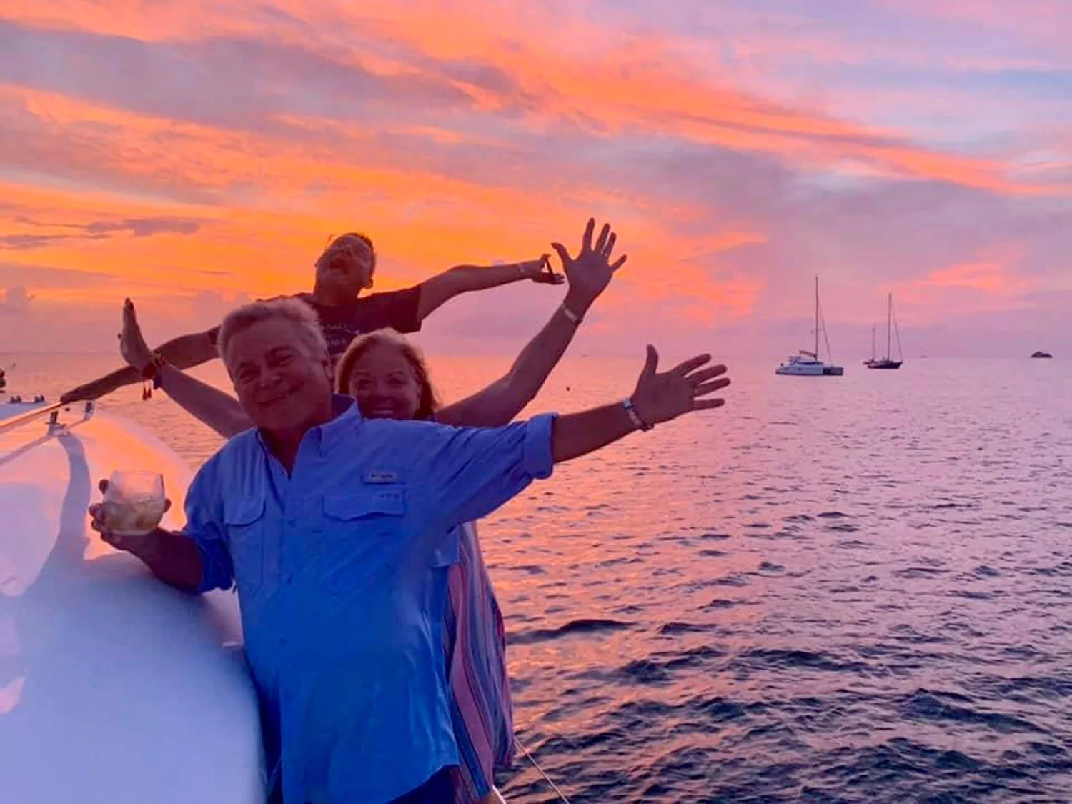 Family smiling together at sunset during a yacht vacation