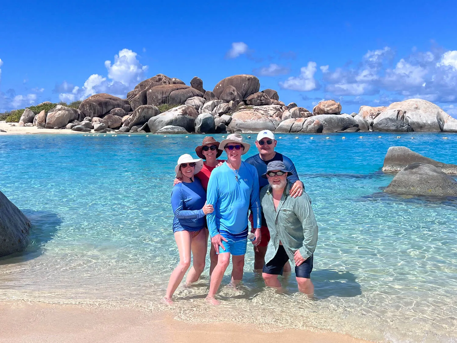Family of five exploring The Baths in the British Virgin Islands