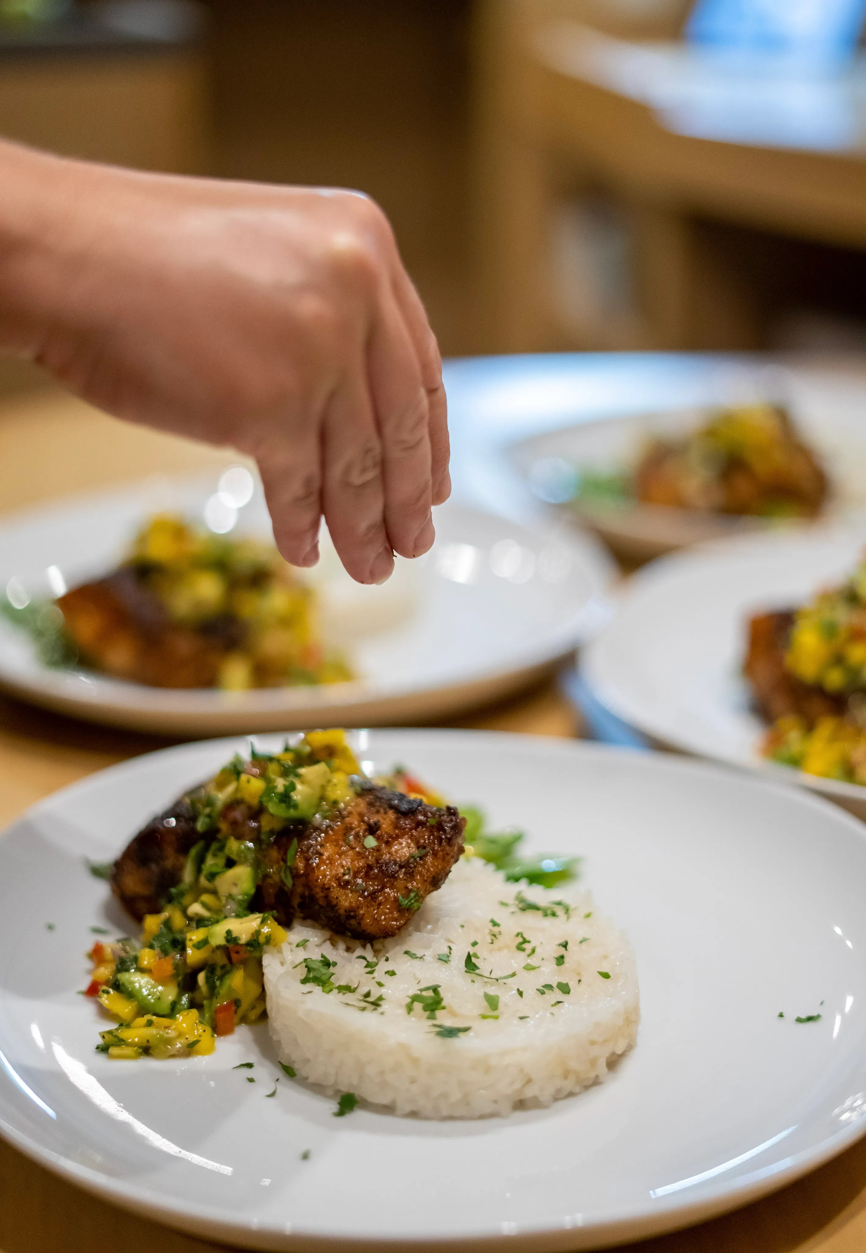 Chef plating a dish in the yacht's galley