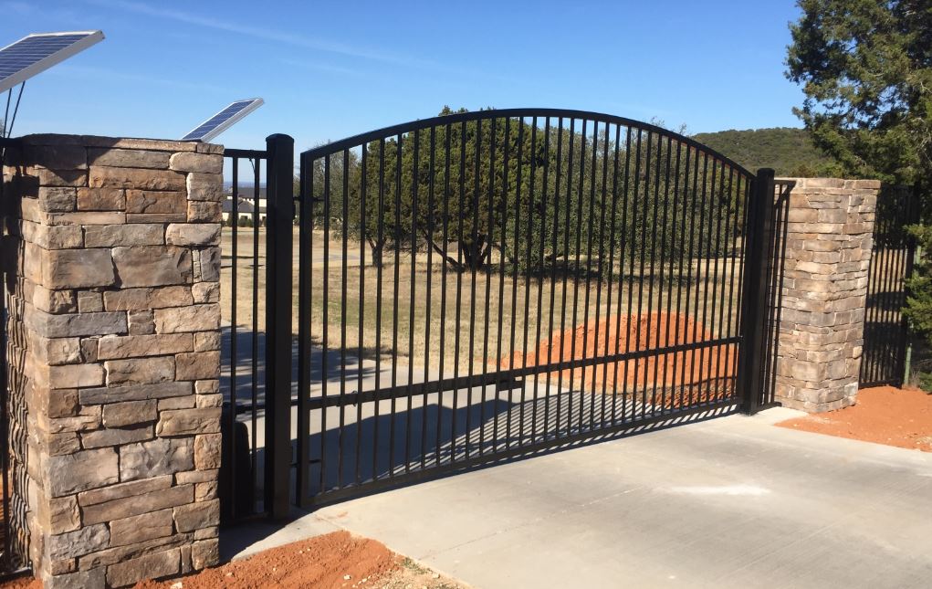 A black steel gate, installed by Your New Gate Company at a residential property