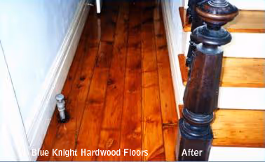 Polished hardwood floor and stair treads with dark wood stair railing post visible on the right, showing improved finish after refinishing.