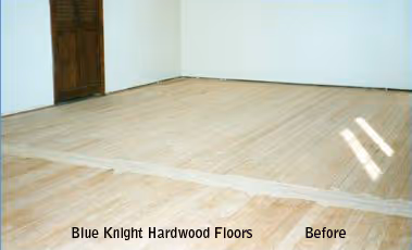 Empty room with partially sanded hardwood floor and a closed wooden door in the corner labeled 'Blue Knight Hardwood Floors Before'.