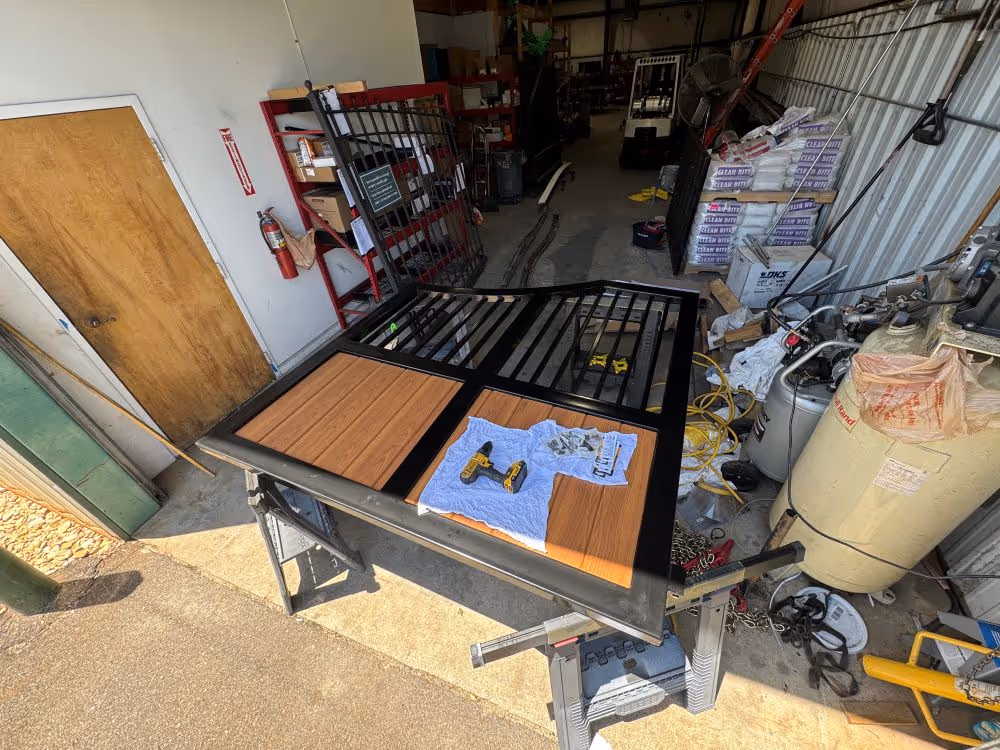 Faux-wood aluminum panels going on the finished frame