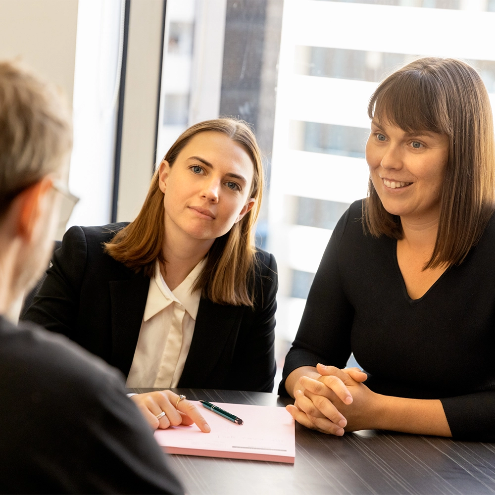 Two of our Melbourne divorce lawyers in a consultation with a client at our offices.