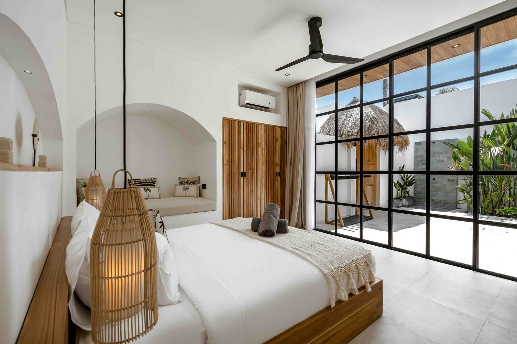 Spacious bedroom interior of a luxury villa in Uluwatu, showcasing the quality of Bali 5-star villas and popular beachside villas.