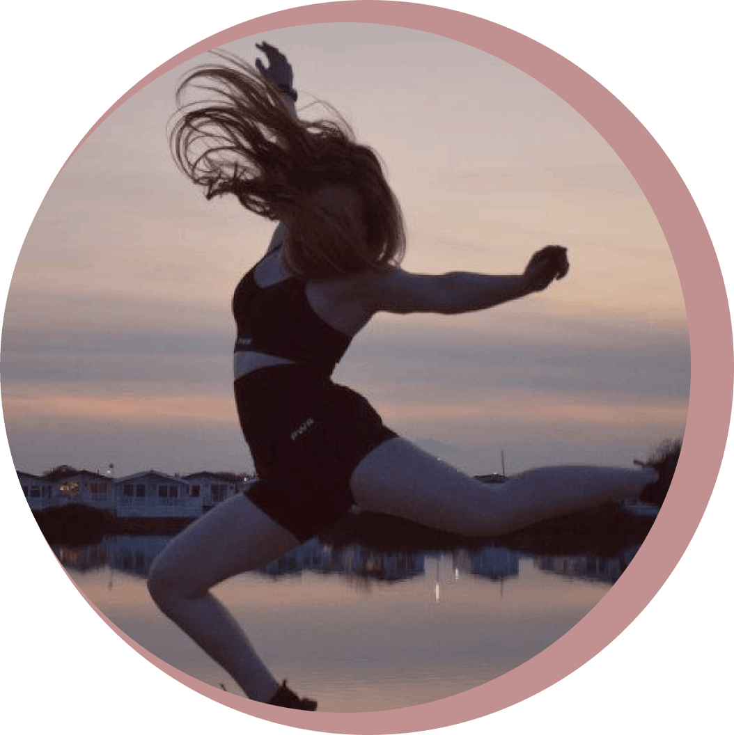 Mols performing a split jump in front of a sunset