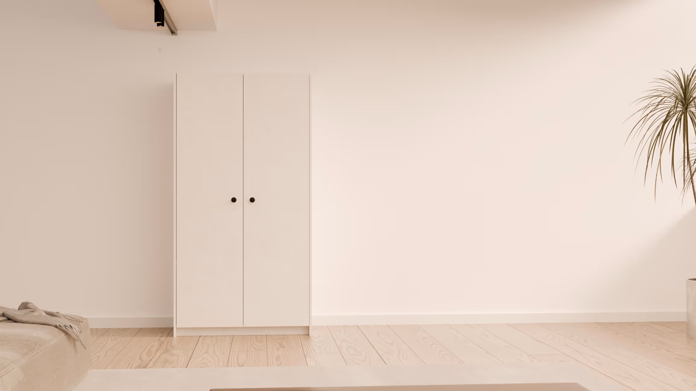 Kledingkast Gabriel in wit, stijlvol geplaatst aan de muur in een strak interieur