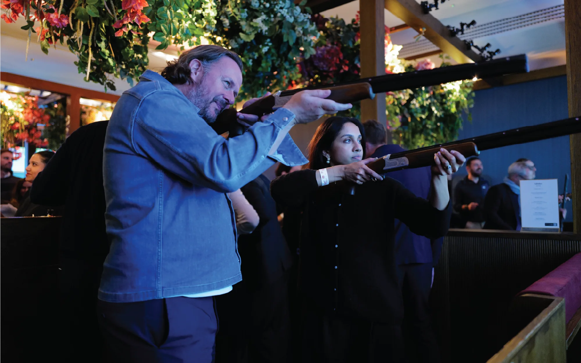 Group of local clients and team members gathered at Clays Soho for a festive client evening with food, drinks, music, and activities.