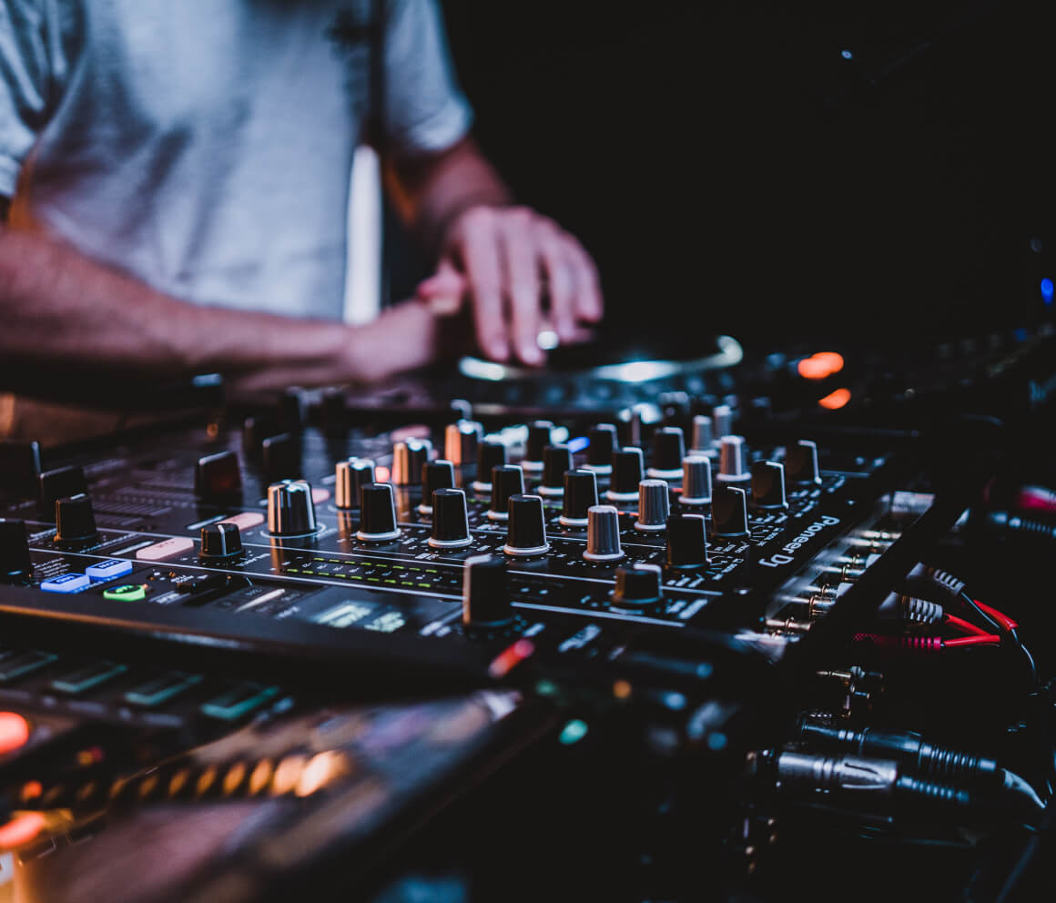 A person using sound and mixing equipment