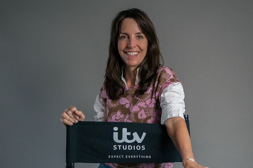 The text ‘Beyond the Screen’ is surrounded by neon signs featuring the titles of ITV Studios productions and related icons.