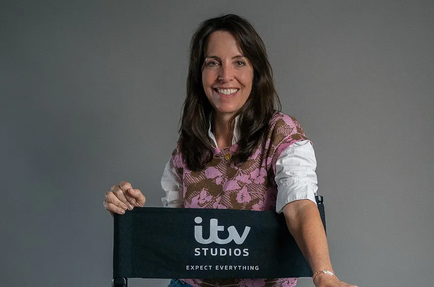 The text ‘Beyond the Screen’ is surrounded by neon signs featuring the titles of ITV Studios productions and related icons.
