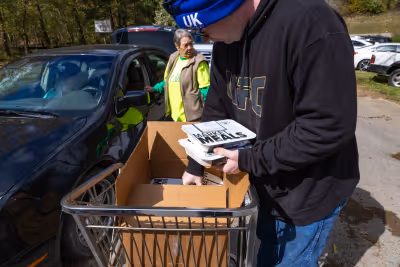 Volunteers helping to distribute meals.