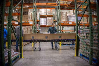 Volunteers help pack holiday food boxes at God's Pantry Food Bank.