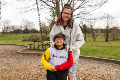 A mother and son at a community park.