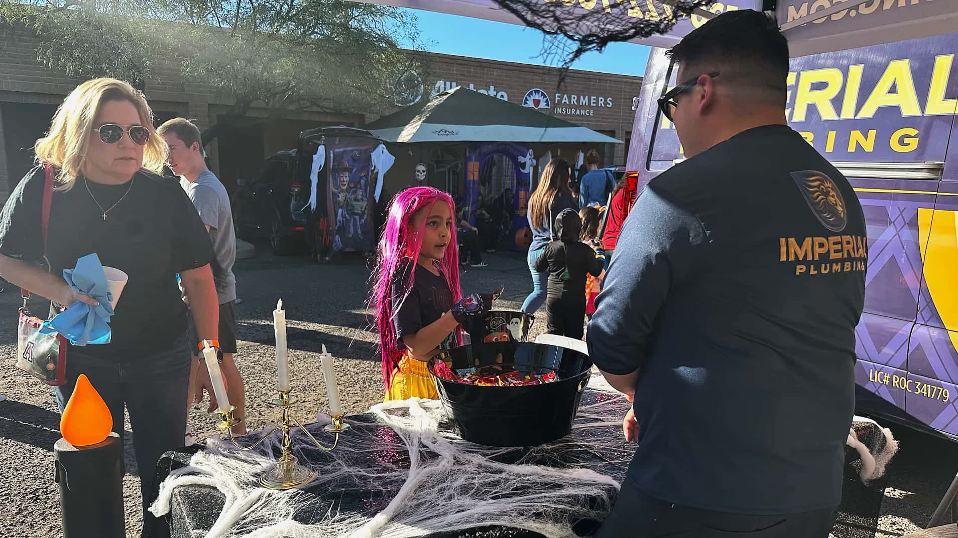 Paul Samorano of Imperial Plumbing, a leading local plumbing company in Tucson, Arizona, connects with the community at the Trunk or Treat event. Imperial Plumbing prioritizes customer care and community involvement.