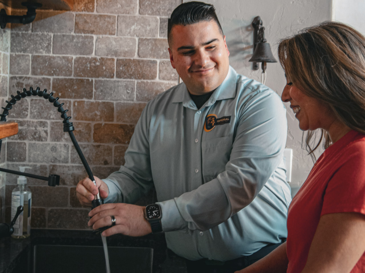 Imperial Plumbing Founder Paul Samorano Help Repair A Kitchen Faucet For A Tucson Homeowner.