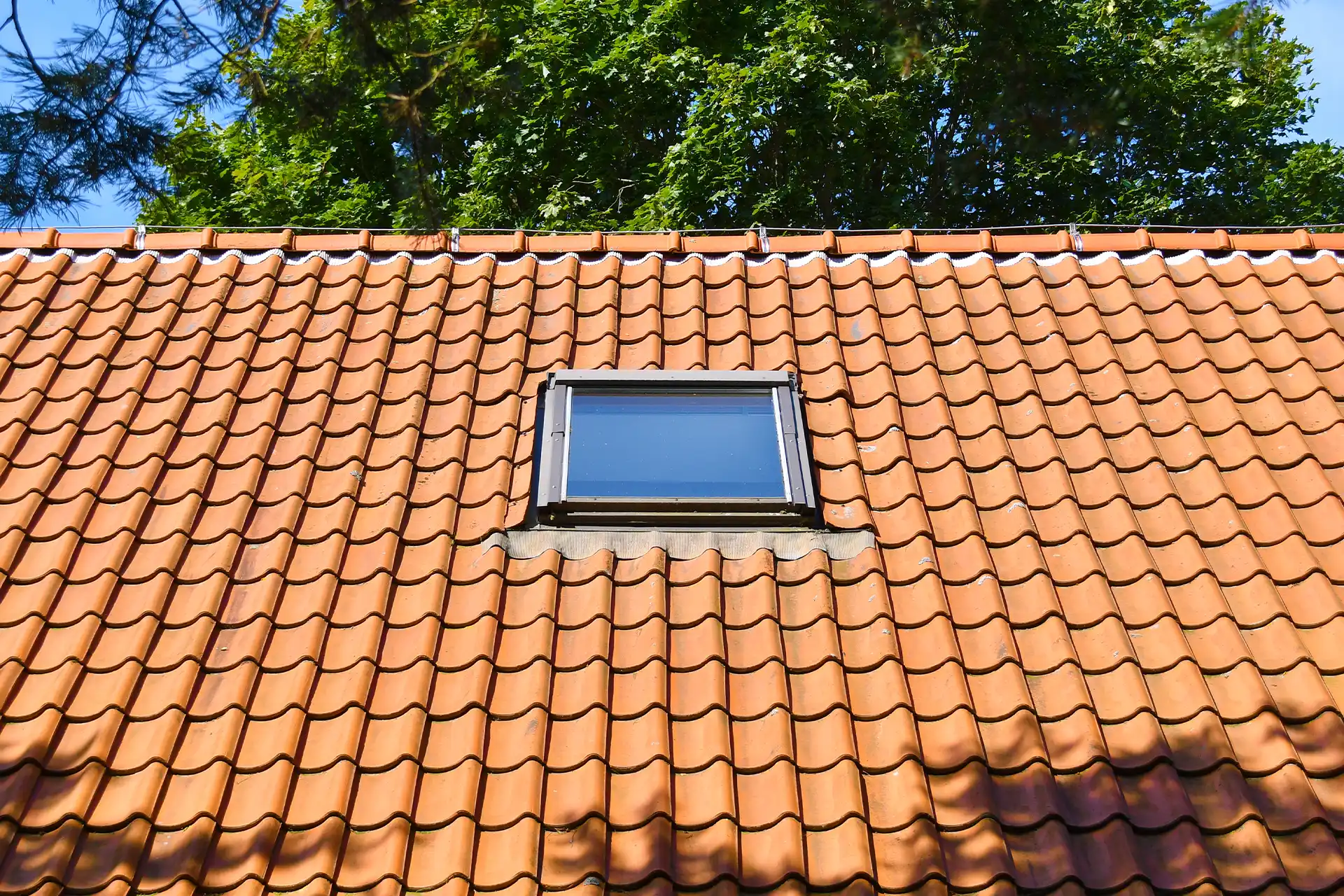Aerial view of a home with a gray asphalt shingle roof