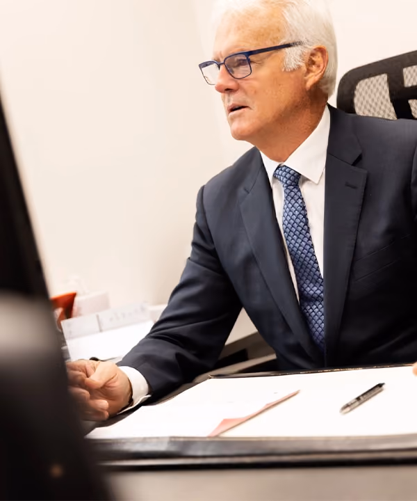 Peter Carew, our director, hard at work in our Melbourne offices, where you can work with our child support lawyers.