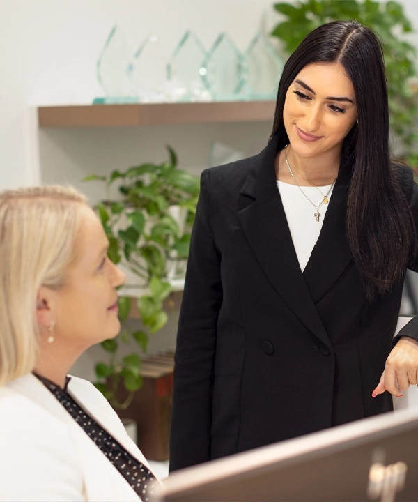 One of our child support lawyers chatting with our receptionist in our Melbourne offices.