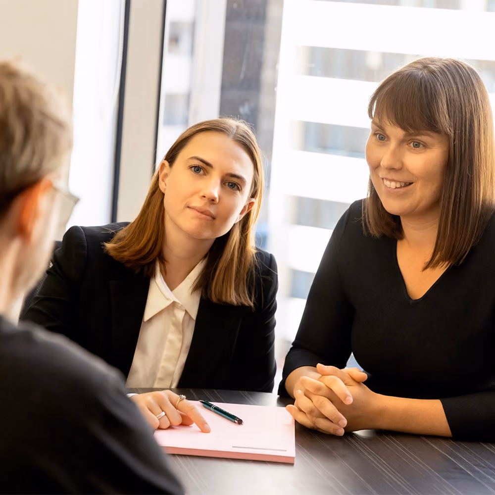 Two of our Melbourne prenuptial agreement lawyers in a consultation with a client at our offices.