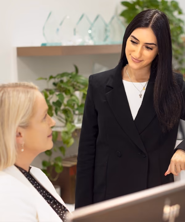 One of our binding financial agreement lawyers chatting with our receptionist at our Melbourne offices.