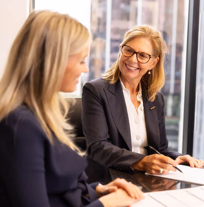 One of our prenup solicitors explaining documents to a client in our Melbourne offices.