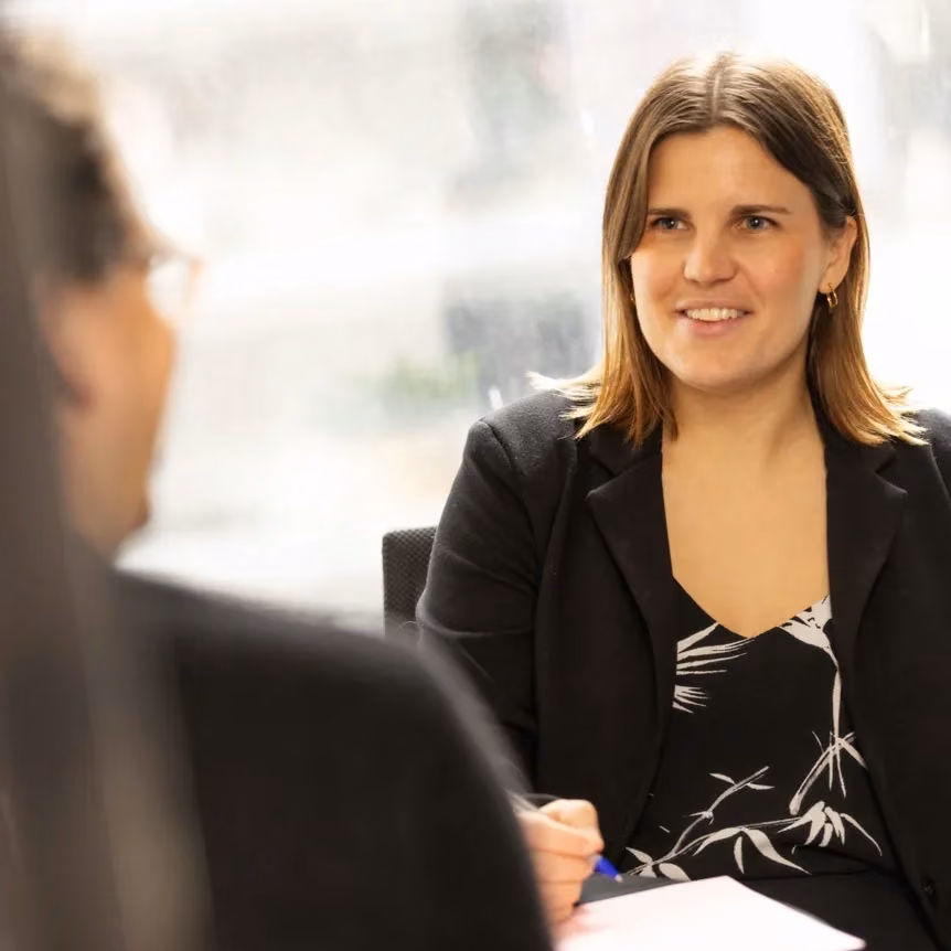 Person discussing divorce application documents with a family lawyer