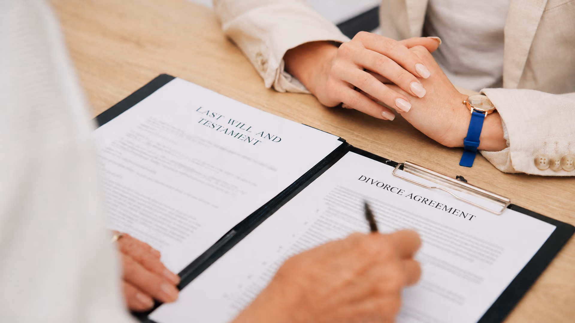 Will and divorce documents displayed together on a desk