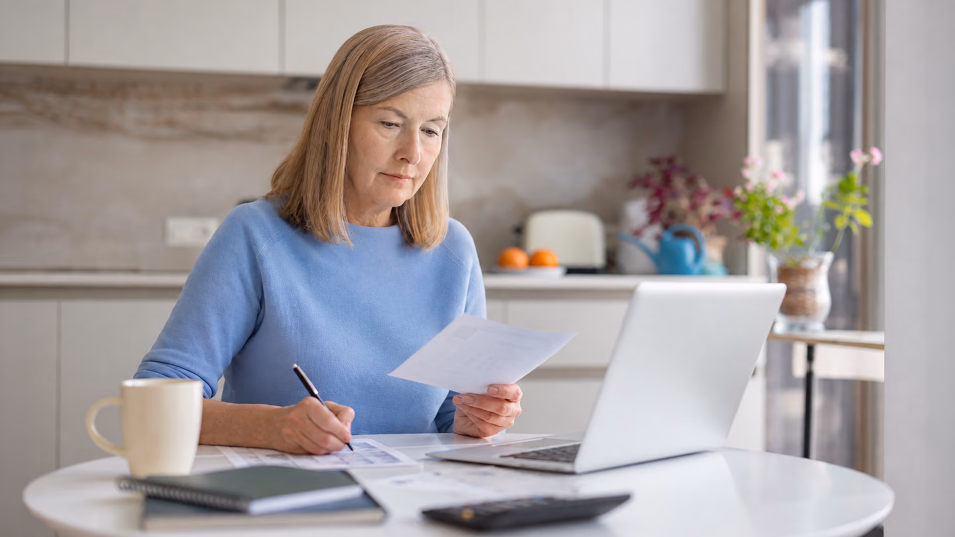 Person reviewing superannuation and life insurance beneficiary documents