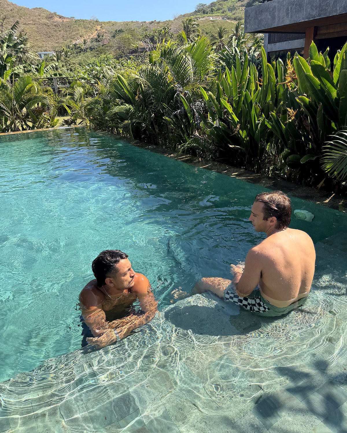 two guests in the pool