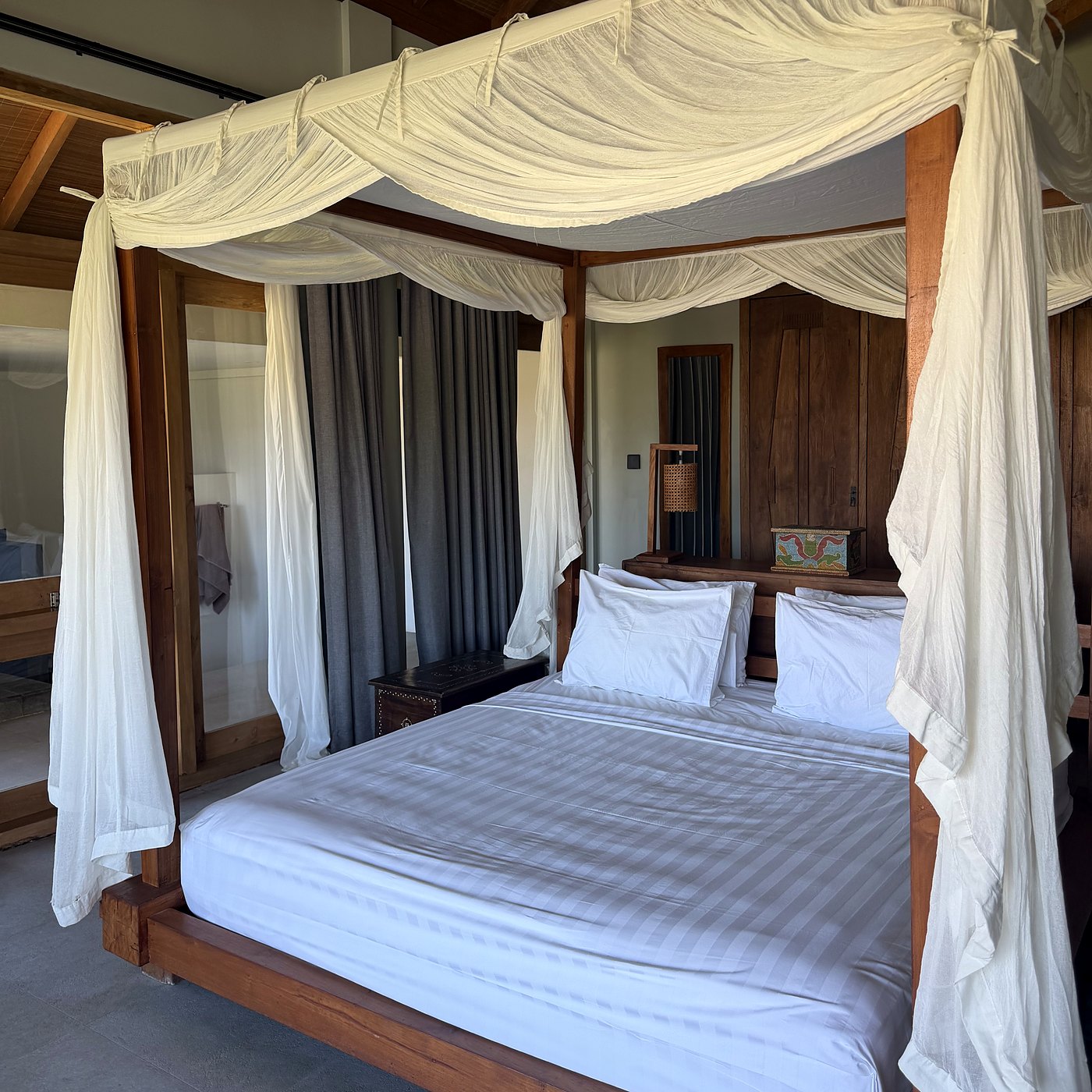 a canopy bed in one of the rooms