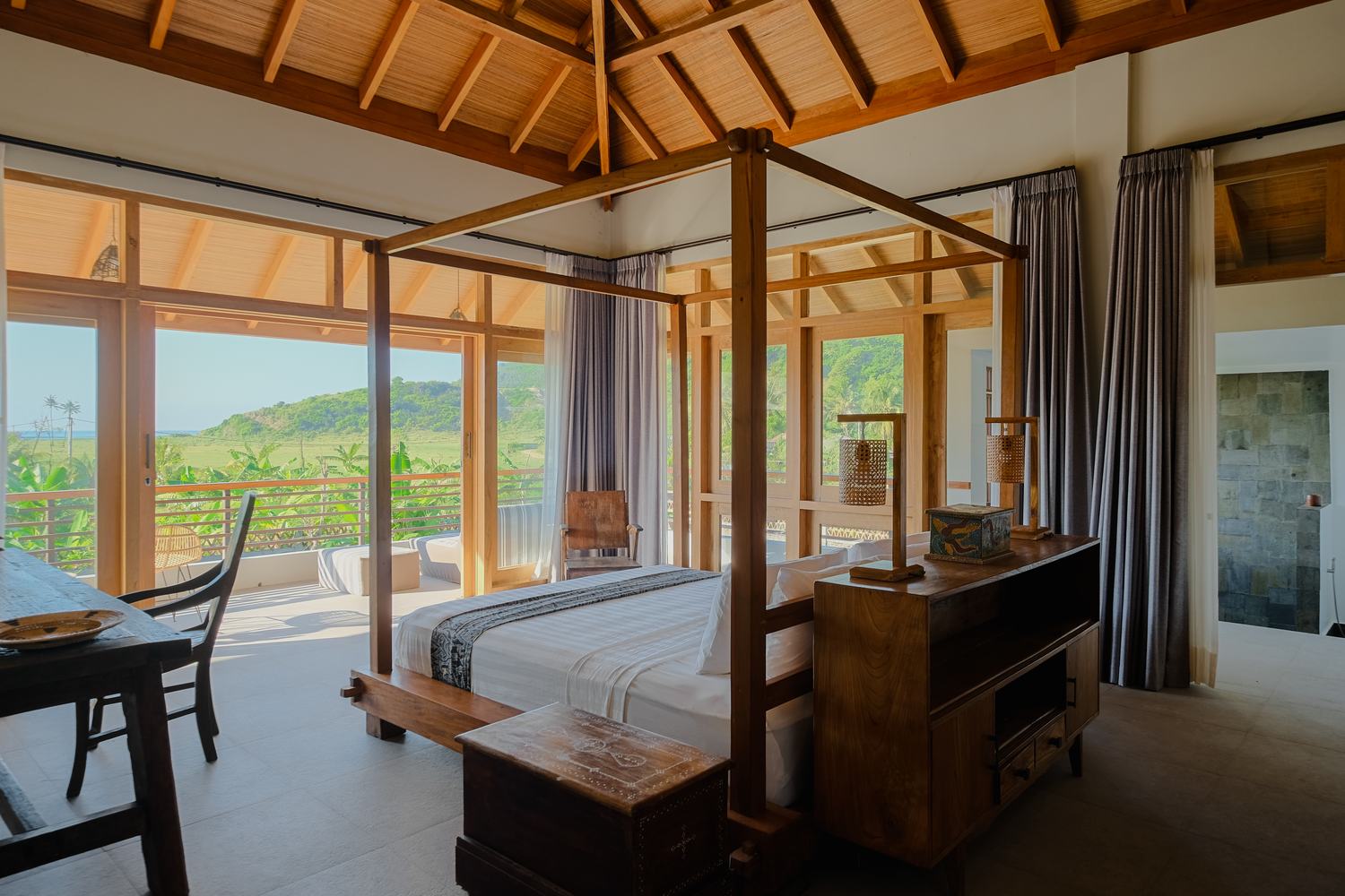 a bedroom looking out to the hills