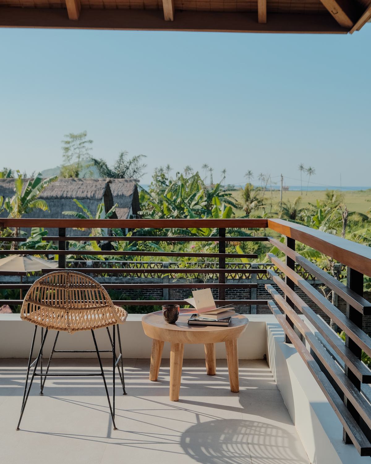 a chair and a table on the balcony
