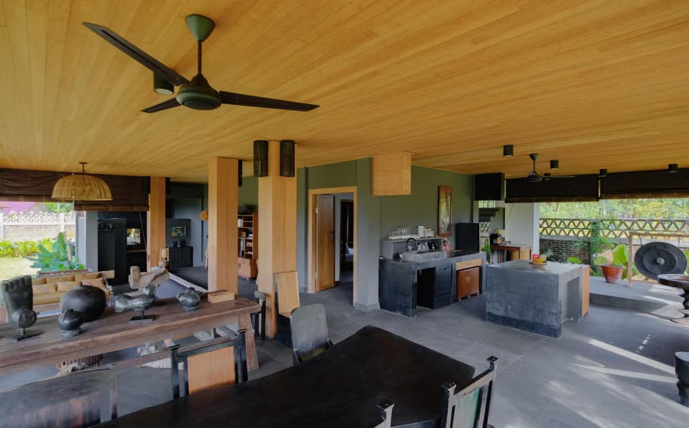 the open living room with the wooden ceiling