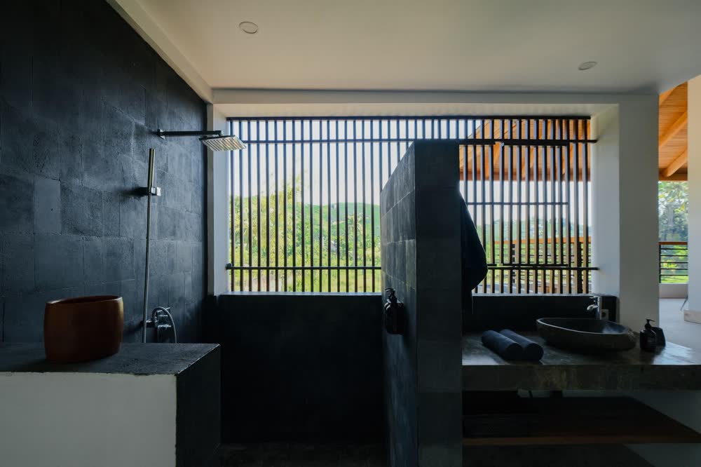 a bathroom with a slatted window