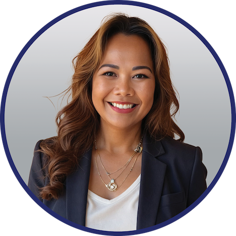 Professional headshot of Channa Tastsides wearing a navy blue blazer, posed against a gray gradient background with a navy circular border.