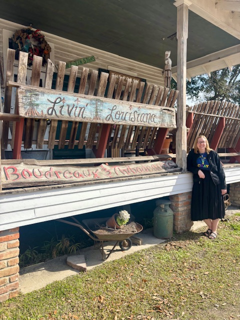 Courtney Messa poses for a photo in Cajun Village
