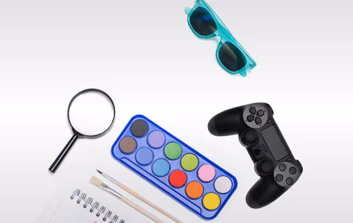 A pair of glasses, a game controller, a pen, and a pair of